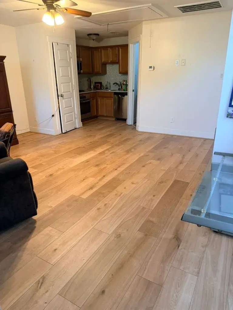 White oak flooring through the living room after remodel by YG Reno