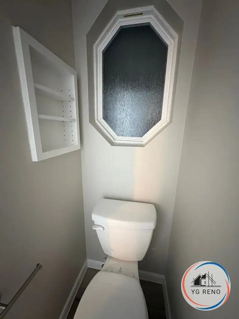 Toilet room refresh with built-in shelving after remodel by YG Reno