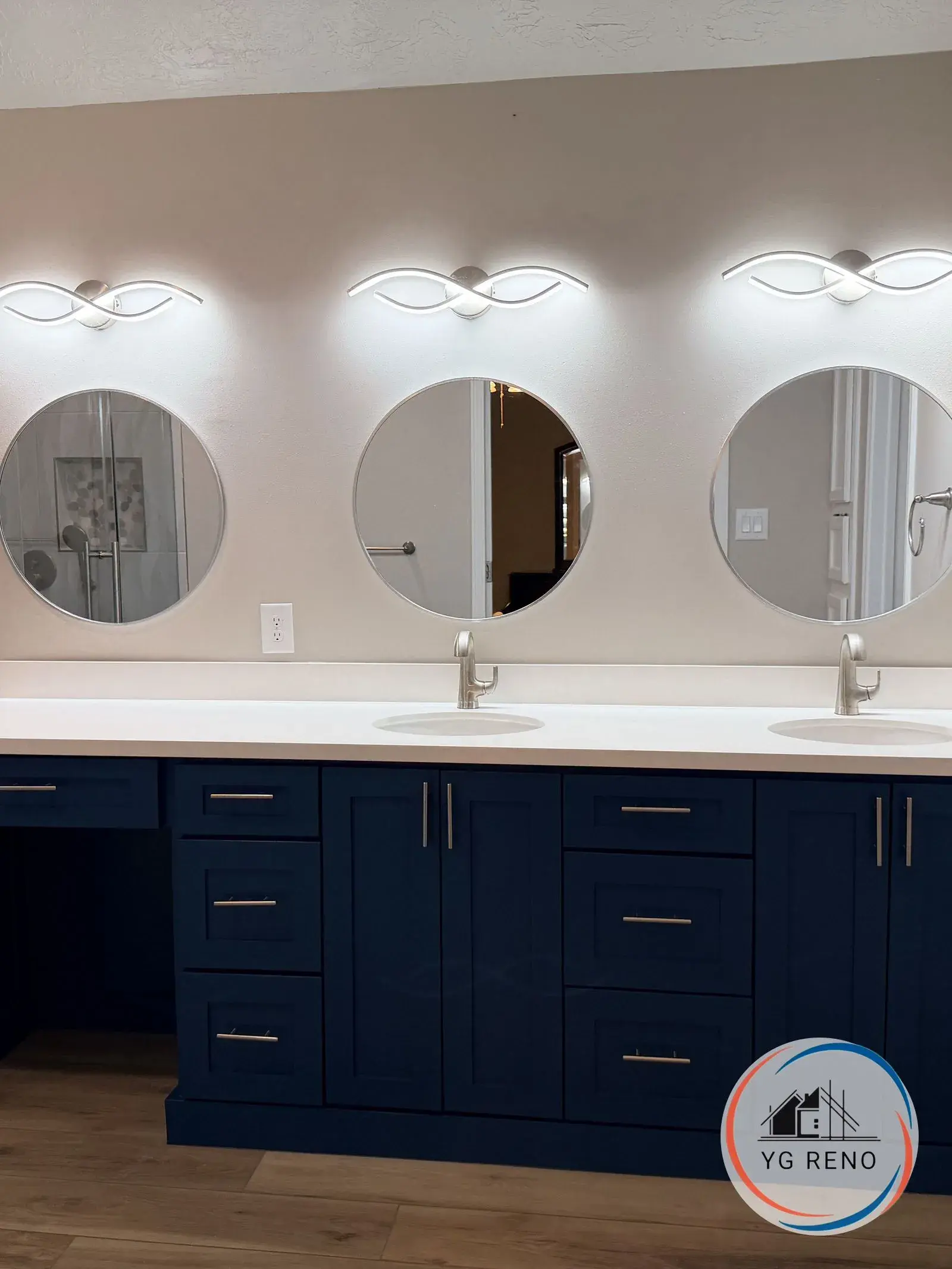 Double vanity to navy shaker with quartz after remodel by YG Reno