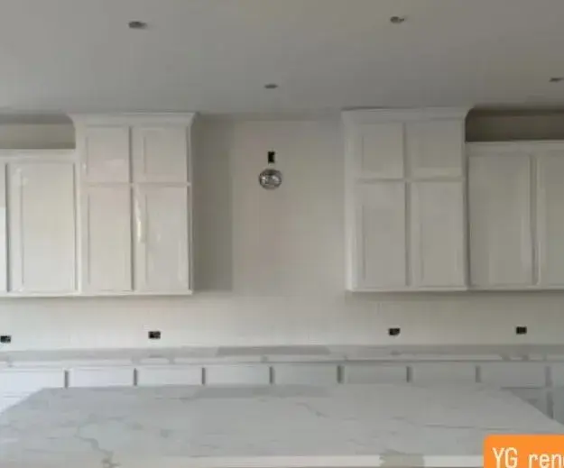 White kitchen with marble-look island